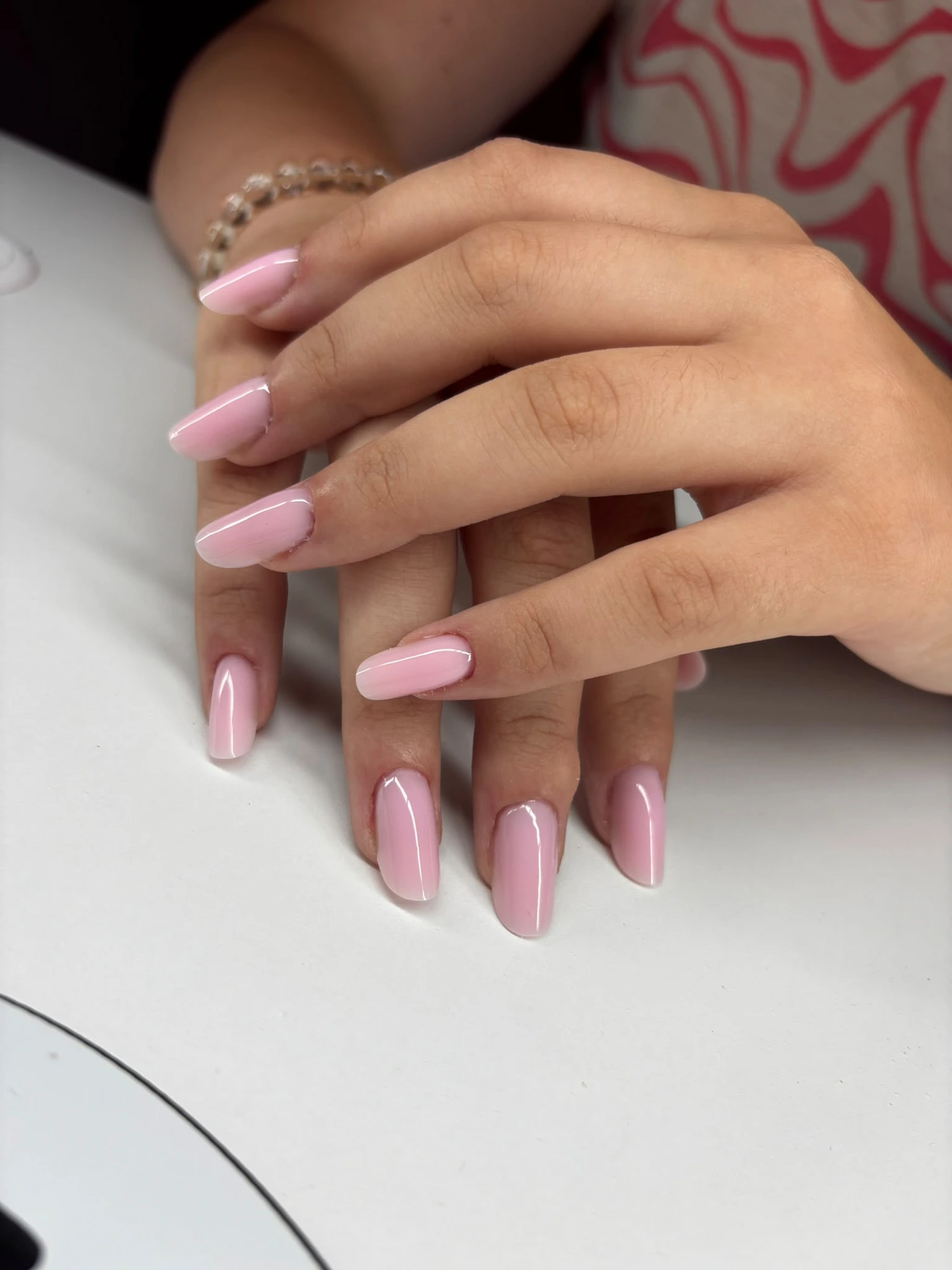 Pink French gel set with glitter accent by Teo's Nails