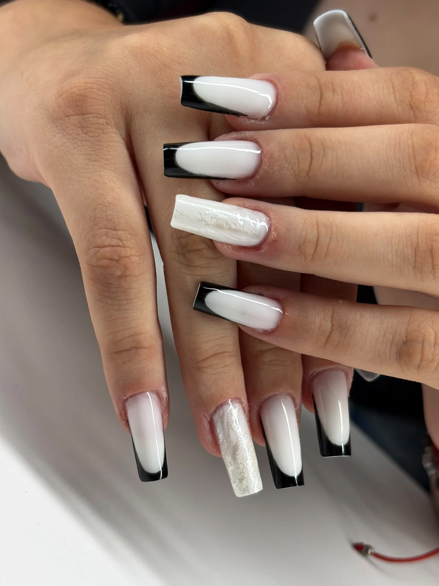 White and black French tip set by Teo's Nails